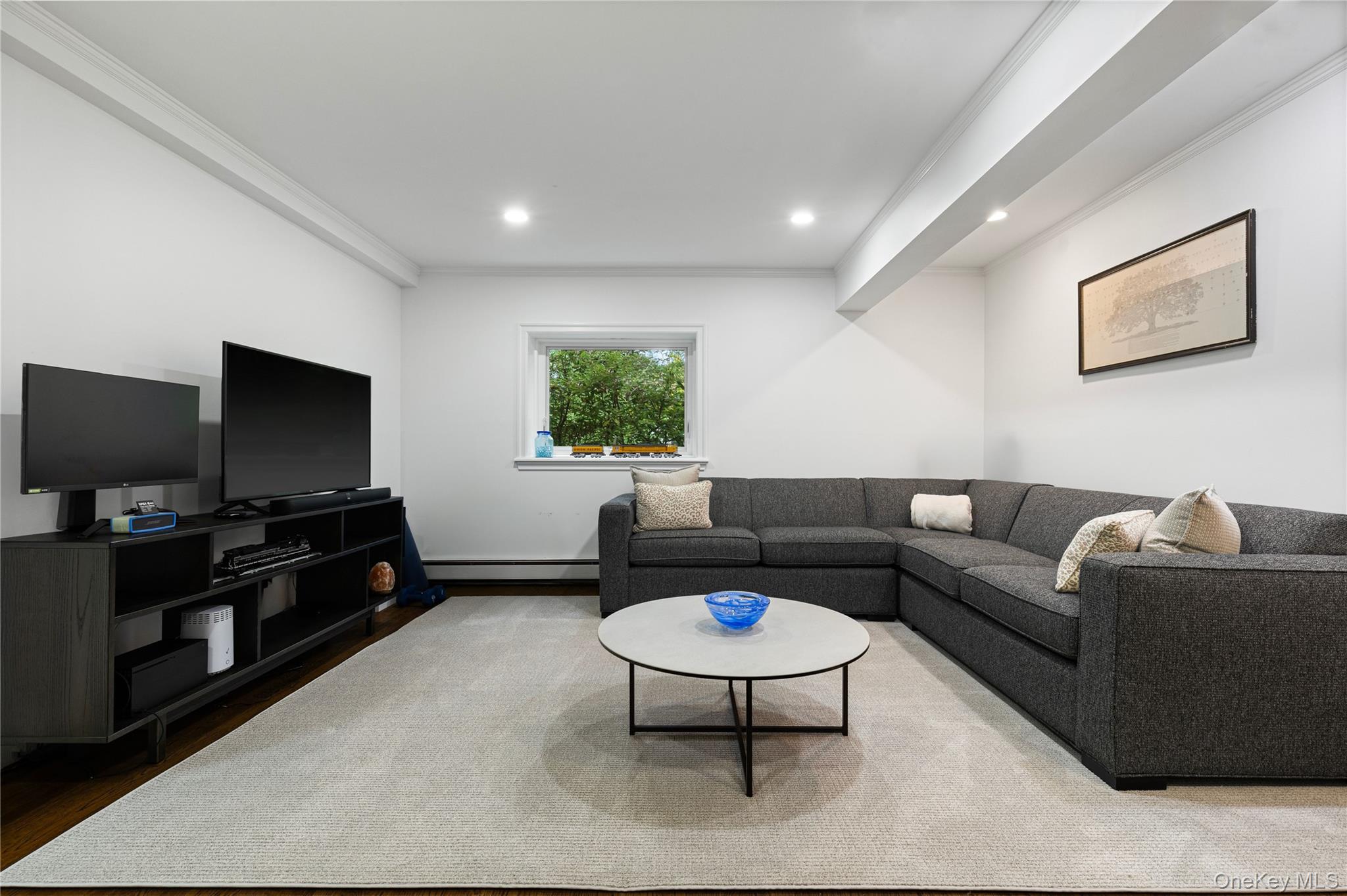 86 Seven Bridges Road Chappaqua, NY 10514 - Photo 14 of 33 a living room with furniture and a flat screen tv