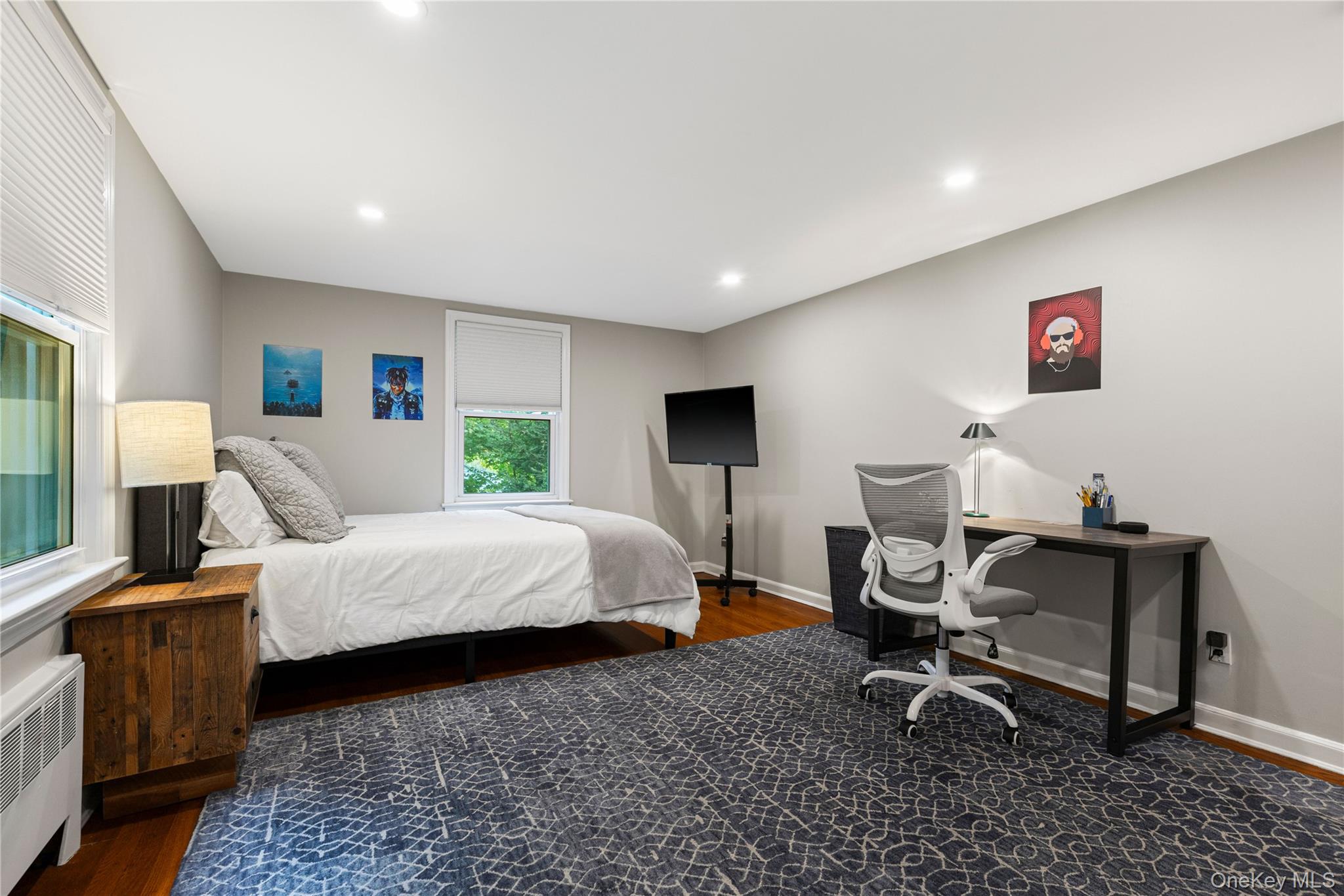 86 Seven Bridges Road Chappaqua, NY 10514 - Photo 19 of 33 a bed room with a bed and a chair