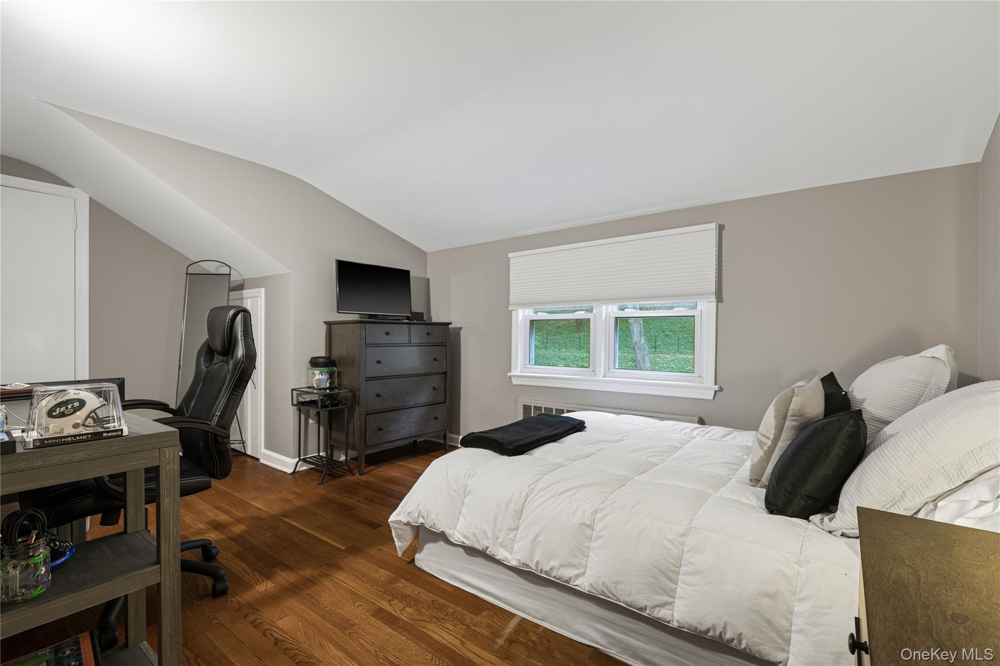 86 Seven Bridges Road Chappaqua, NY 10514 - Photo 21 of 33 a bedroom with a bed and wooden floor
