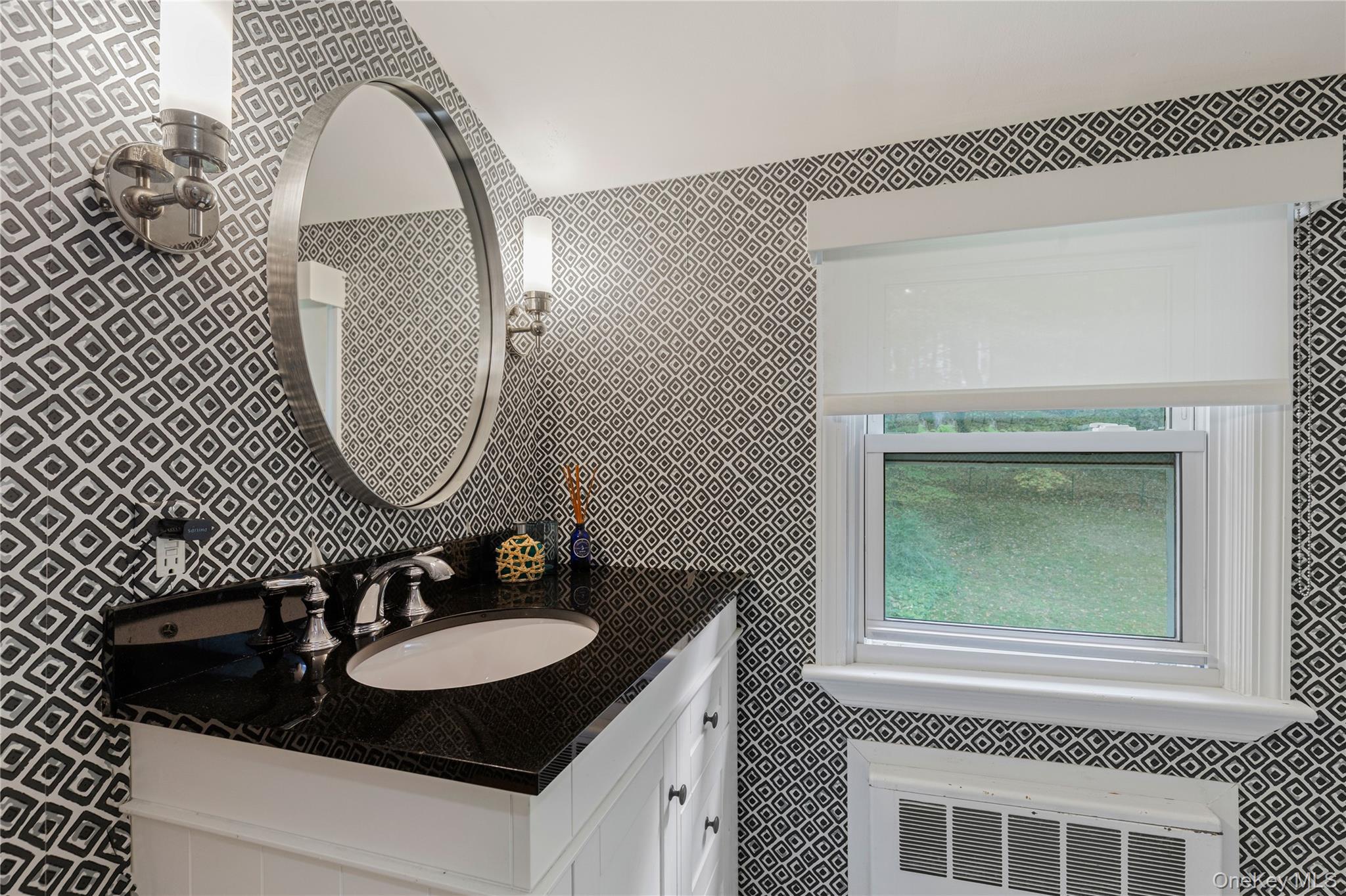 86 Seven Bridges Road Chappaqua, NY 10514 - Photo 23 of 33 a bathroom with a sink and a mirror