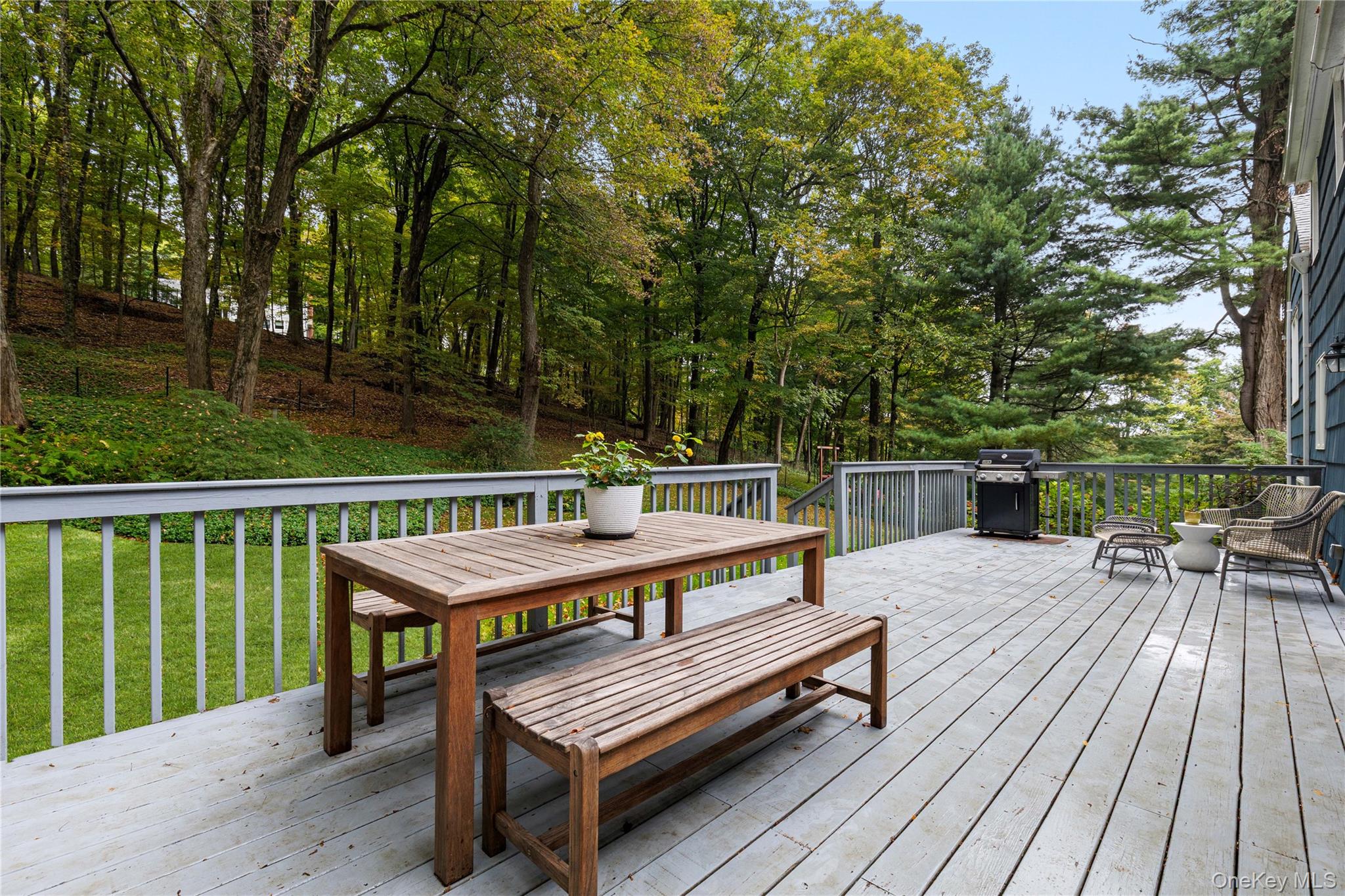 86 Seven Bridges Road Chappaqua, NY 10514 - Photo 24 of 33 a view of a wooden deck with chairs