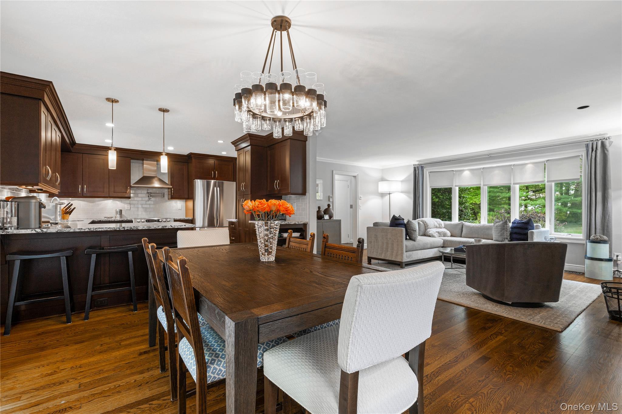 86 Seven Bridges Road Chappaqua, NY 10514 - Photo 4 of 33 a view of a dining room with furniture wooden floor and chandelier