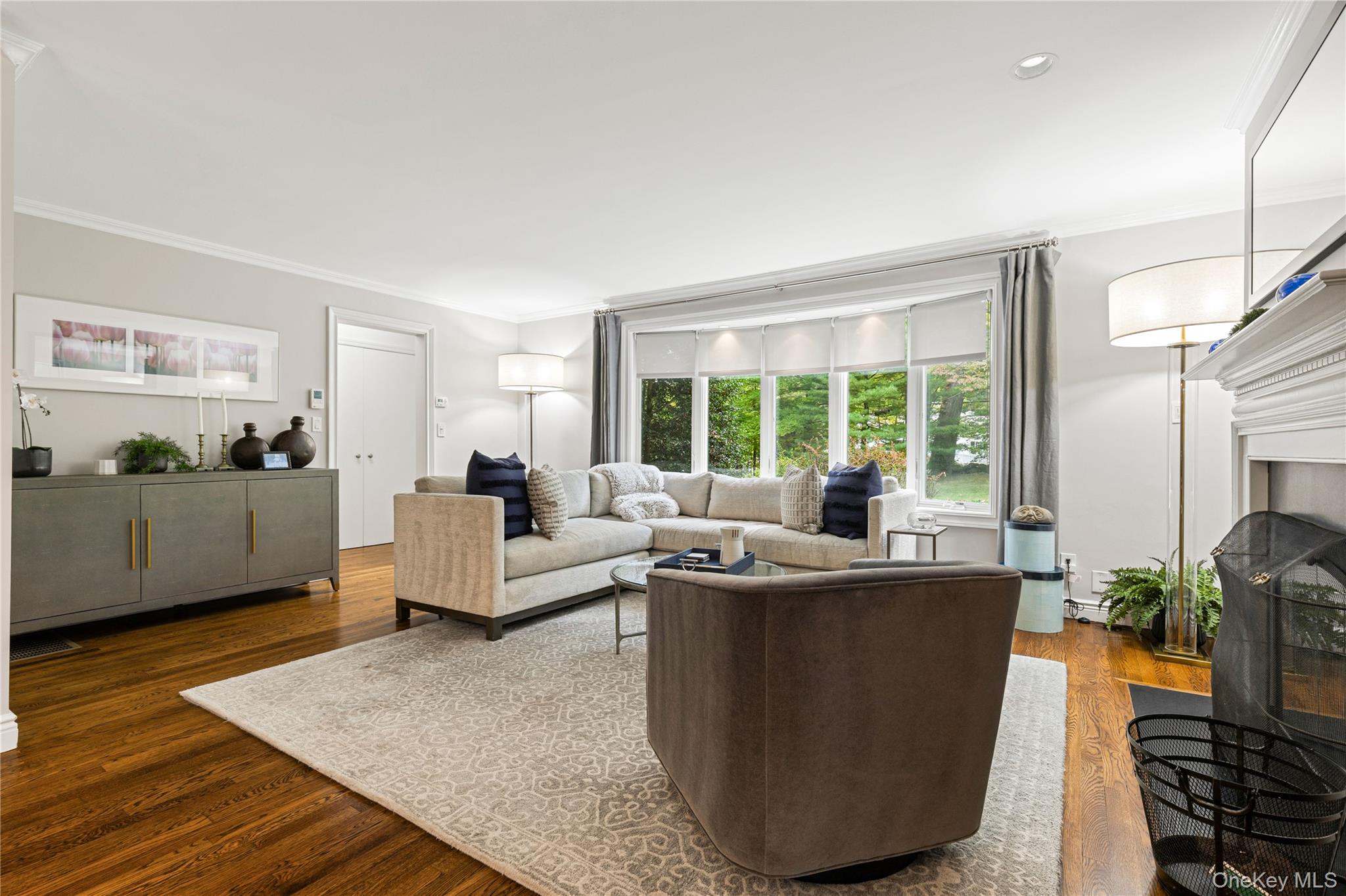86 Seven Bridges Road Chappaqua, NY 10514 - Photo 5 of 33 a living room with furniture potted plant and a large window