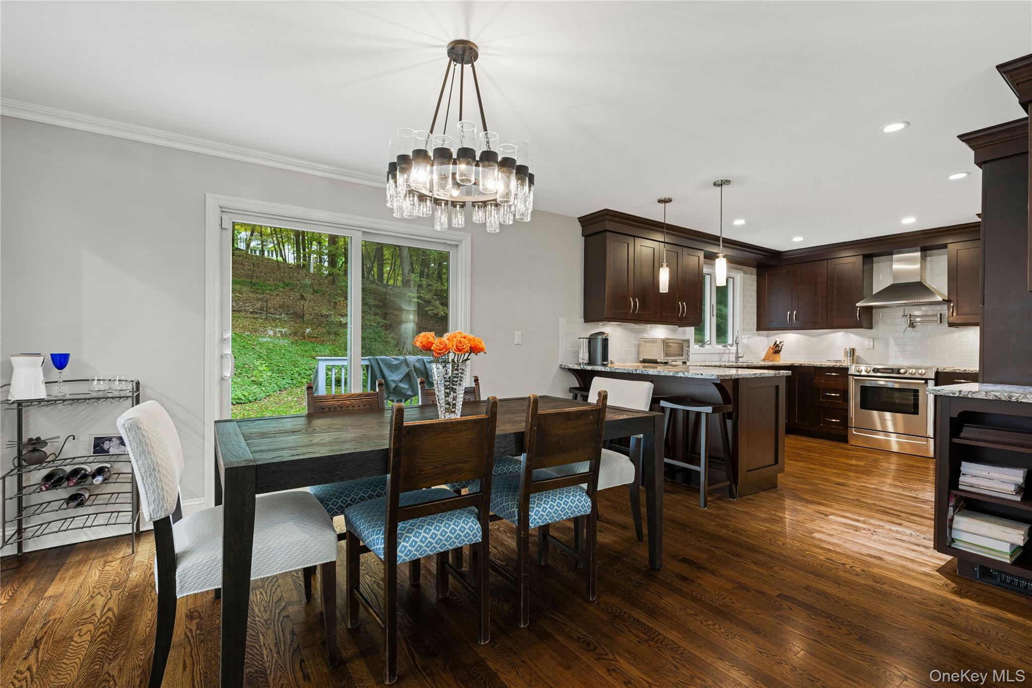 86 Seven Bridges Road Chappaqua, NY 10514 - Photo 7 of 33 a view of a dining room with furniture wooden floor and chandelier