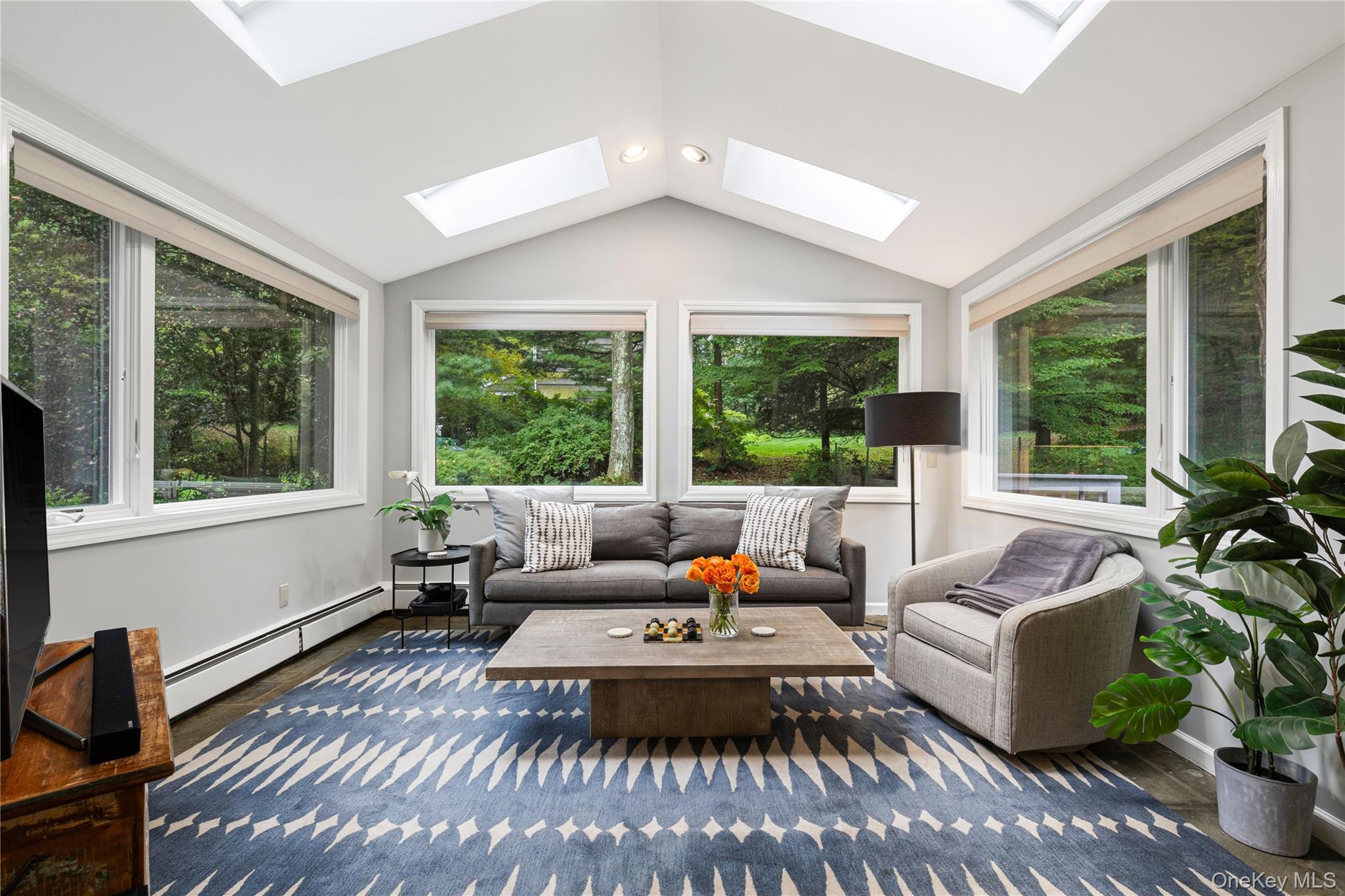 86 Seven Bridges Road Chappaqua, NY 10514 - Photo 9 of 33 a living room with furniture and a large window