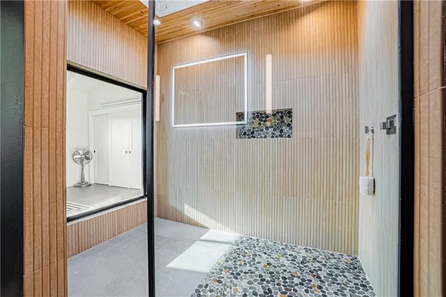 a bathroom with a shower and a sink