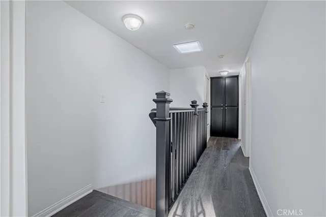 a view of hallway with wooden floor