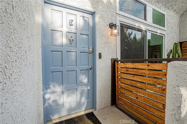 a bathroom with a granite countertop toilet and a sink