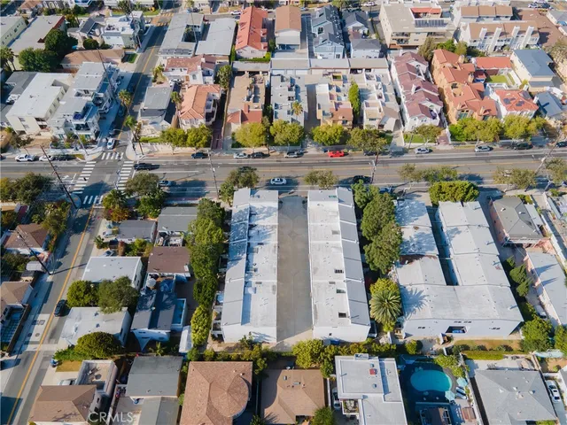 an aerial view of a houses with yard