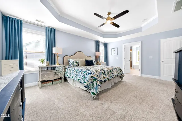 a bath tub sitting next to a white sink