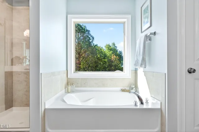 a bathroom with a double vanity sink and mirror