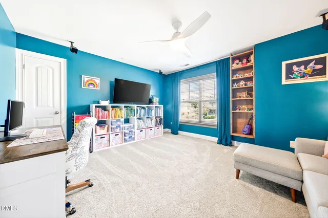 a view of a livingroom with workspace and a couch