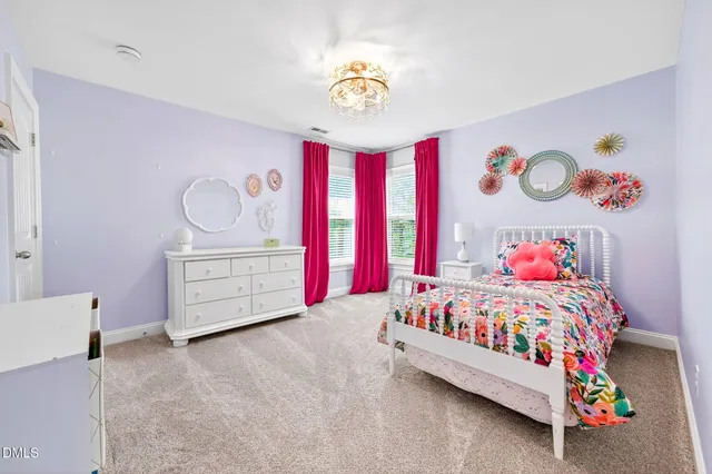 a bathroom with a granite countertop toilet a sink and a mirror