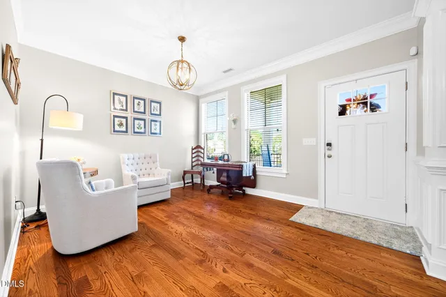 a living room with furniture and a table