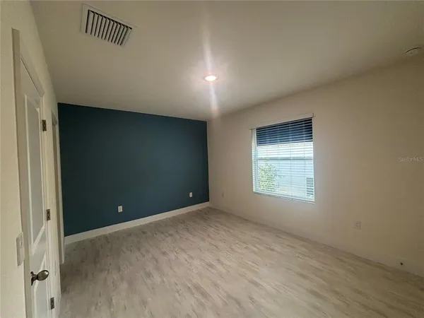a view of an empty room with a window