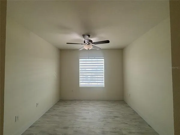 a view of a chandelier fan in a room