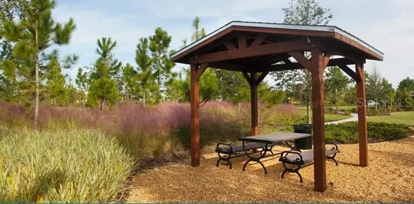 a view of a chairs and table in the patio
