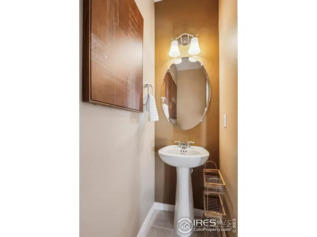 a bathroom with a toilet and a mirror