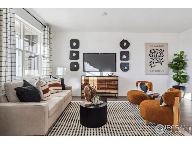 a living room with furniture and flat screen tv
