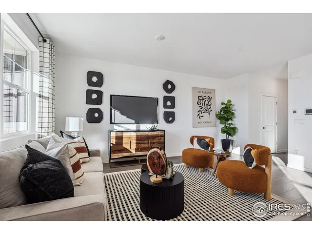 a bedroom with furniture a bed and a large window