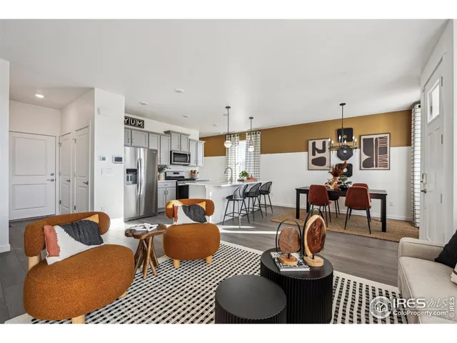 a living room with furniture and a table