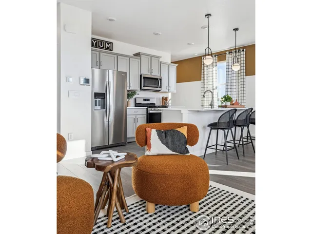 a view of kitchen and dining area with chandelier