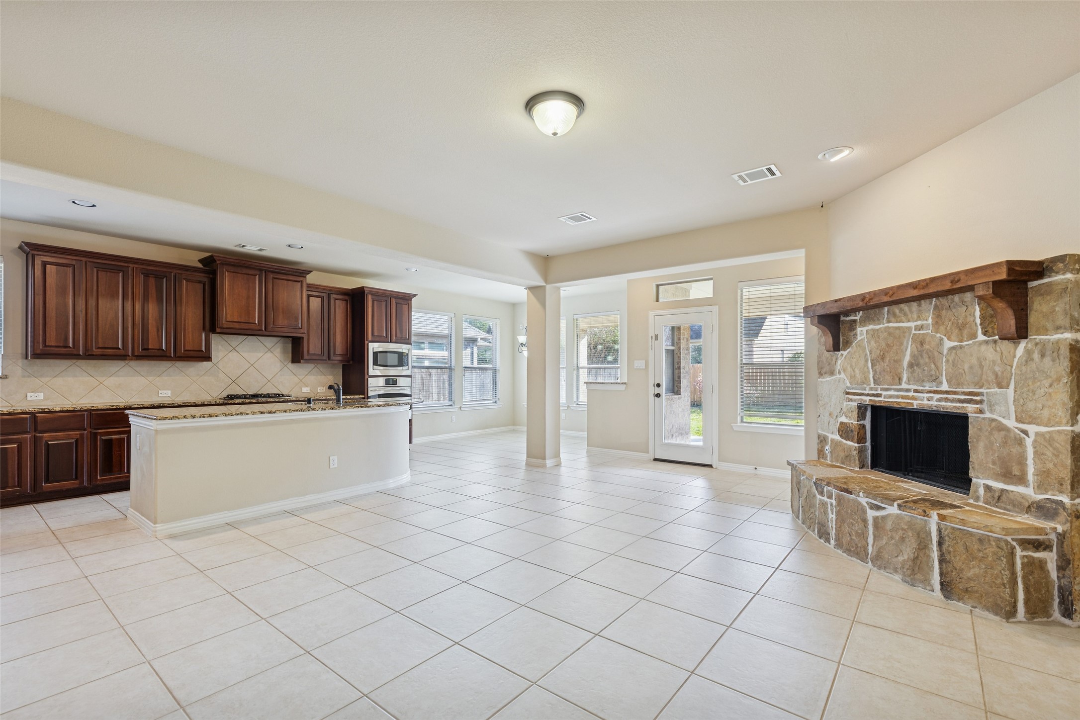 11 Vershire Circle Magnolia, TX 77354 - Photo 12 of 44 a large white kitchen with cabinets