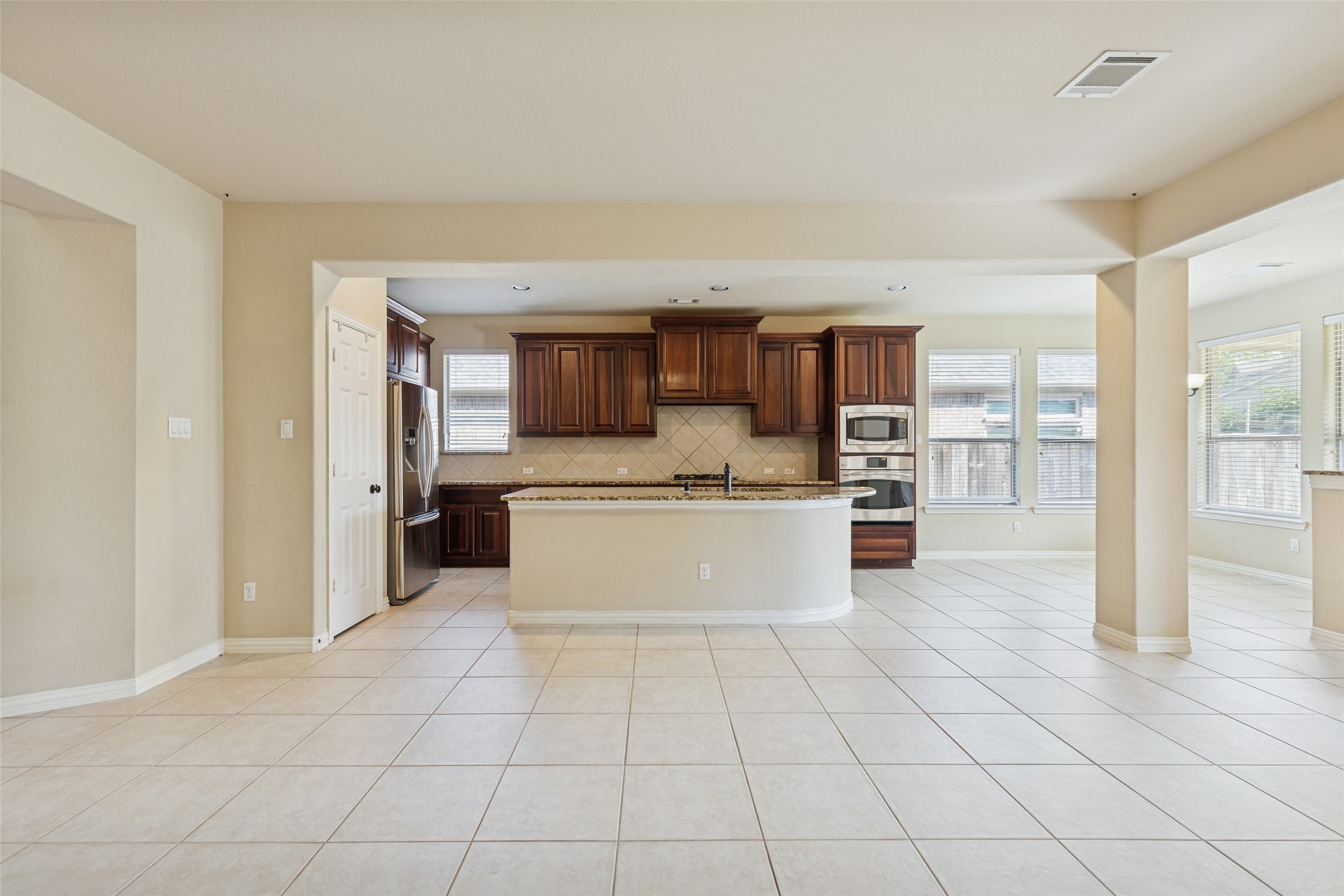 11 Vershire Circle Magnolia, TX 77354 - Photo 14 of 44 a large white kitchen with a stove a sink dishwasher and a refrigerator