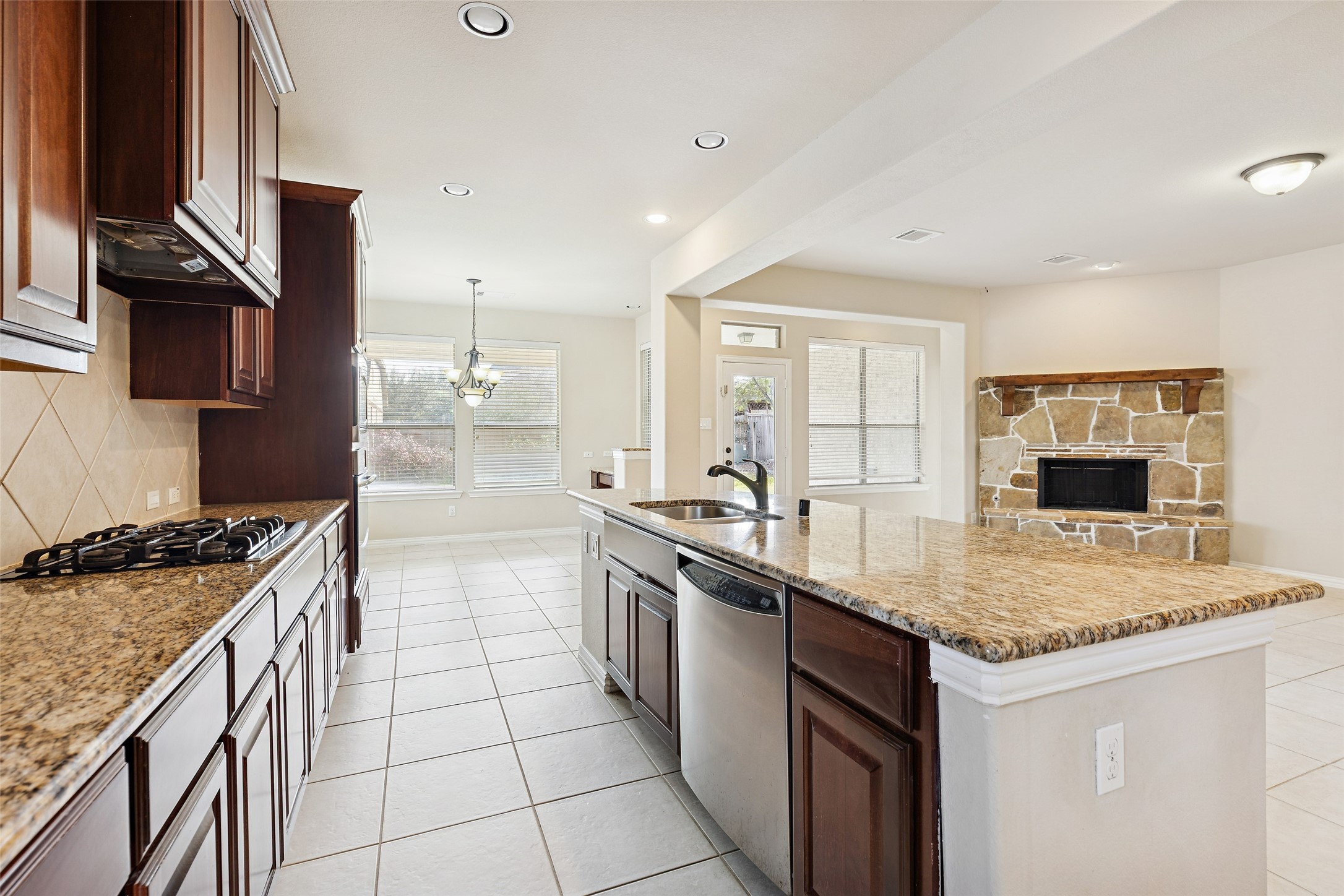 11 Vershire Circle Magnolia, TX 77354 - Photo 15 of 44 a kitchen with stainless steel appliances granite countertop a sink stove and refrigerator