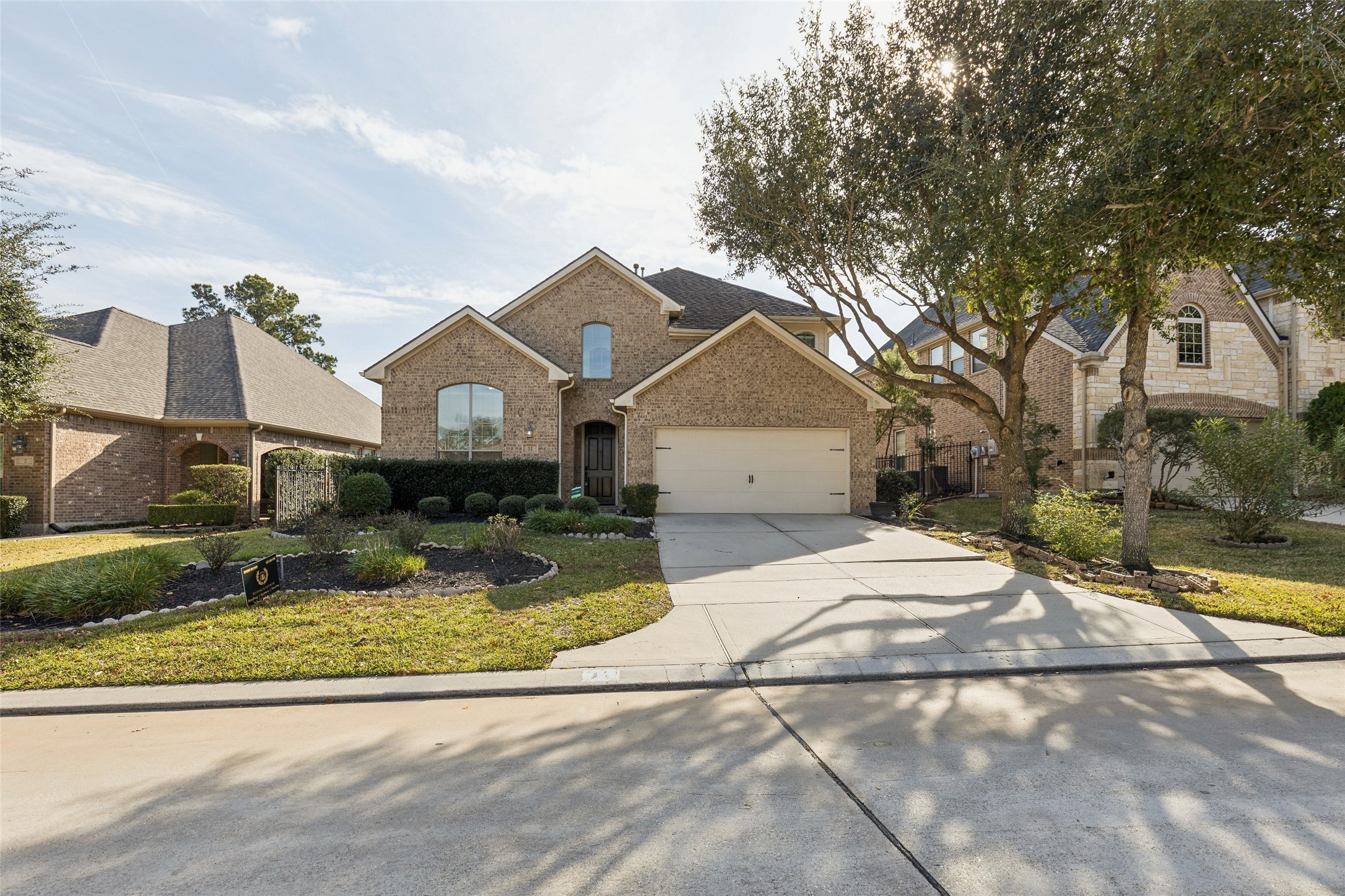 11 Vershire Circle Magnolia, TX 77354 - Photo 2 of 44 a front view of a house with a yard and garage