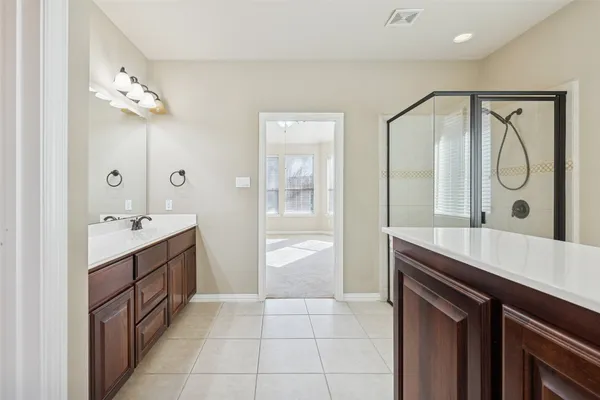 a bathroom with a sink and mirror