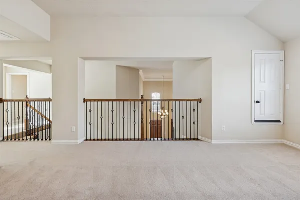 a view of a hallway with a window