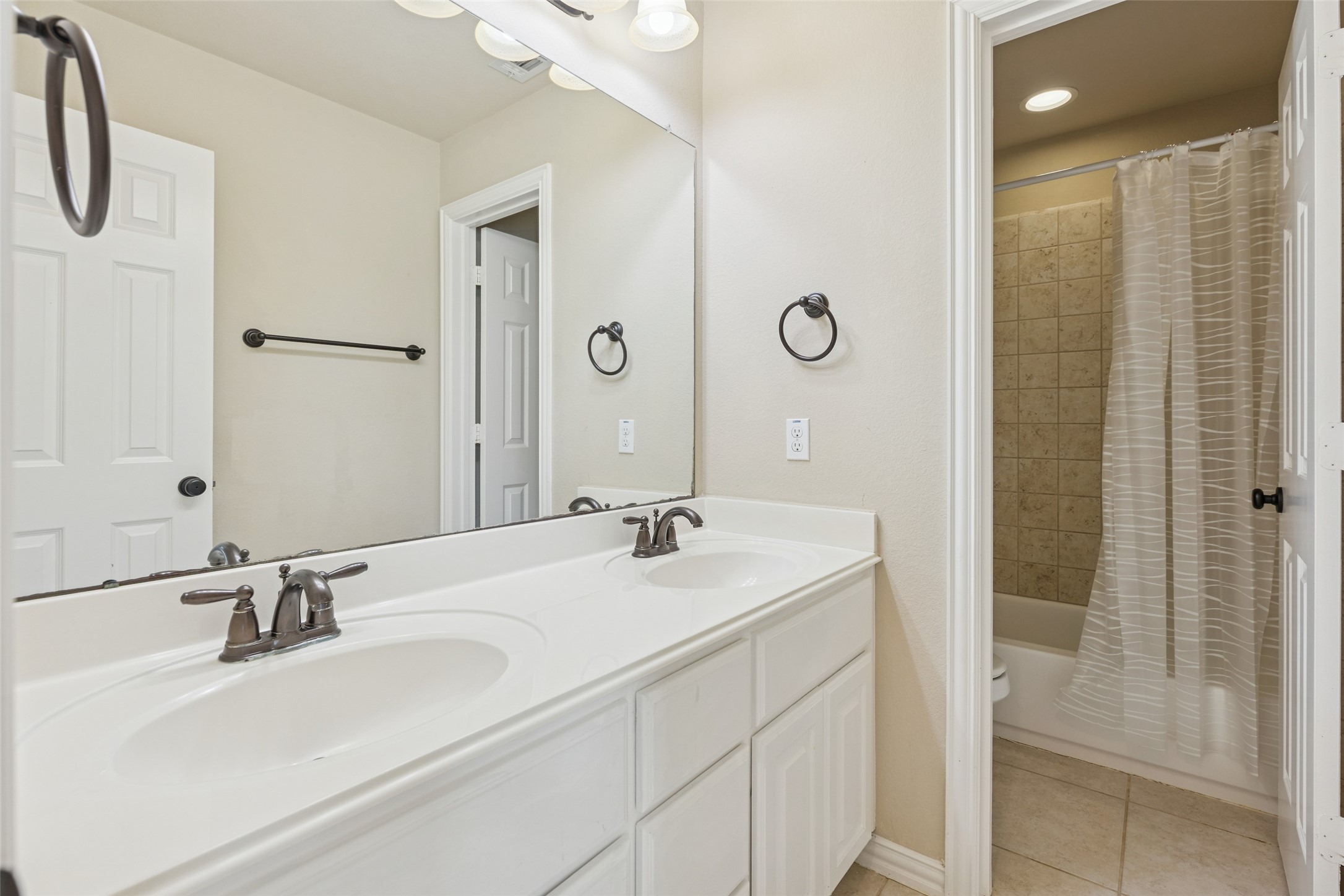11 Vershire Circle Magnolia, TX 77354 - Photo 34 of 44 a bathroom with a sink and a mirror