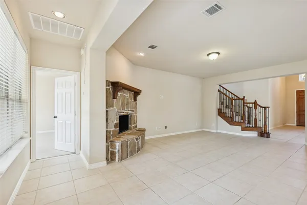 a large white kitchen with cabinets