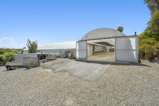 a view of a house with a yard and garage