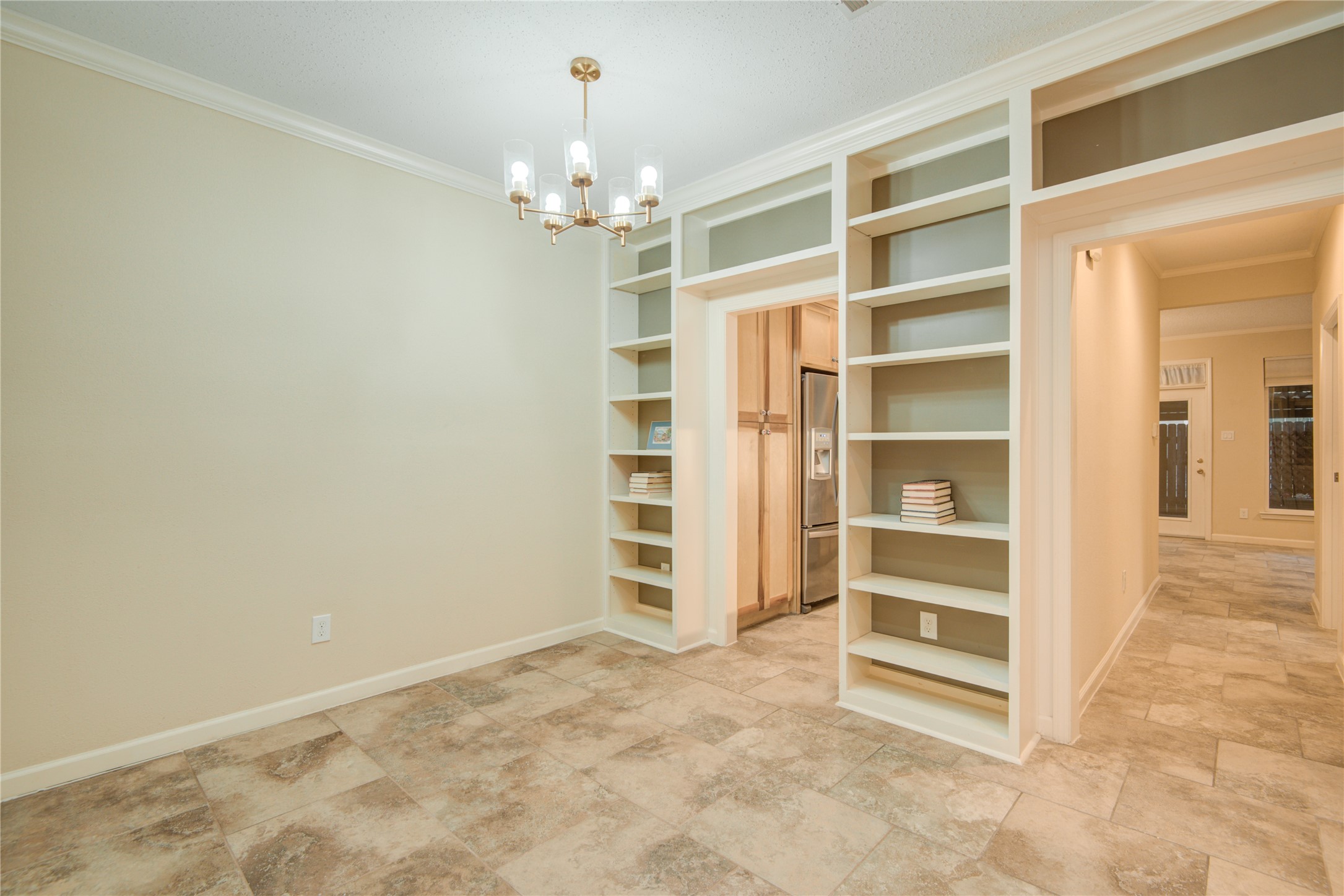 7449 Brompton Street, Unit 7449 Houston, TX 77025 - Photo 11 of 46 wooden floor in an empty room with a window