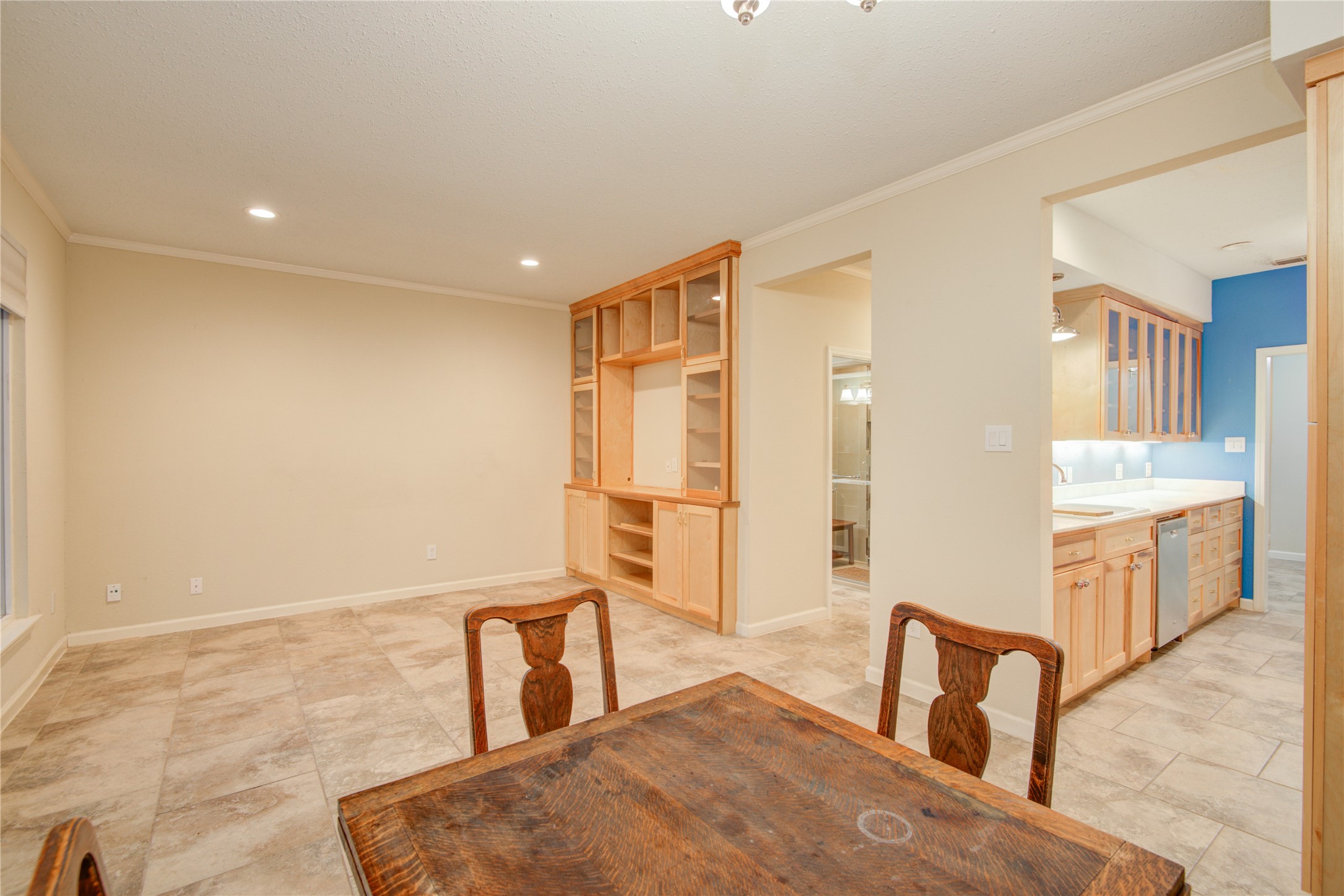 7449 Brompton Street, Unit 7449 Houston, TX 77025 - Photo 17 of 46 More custom built ins for the entertainment center in the family room w/ tile throughout