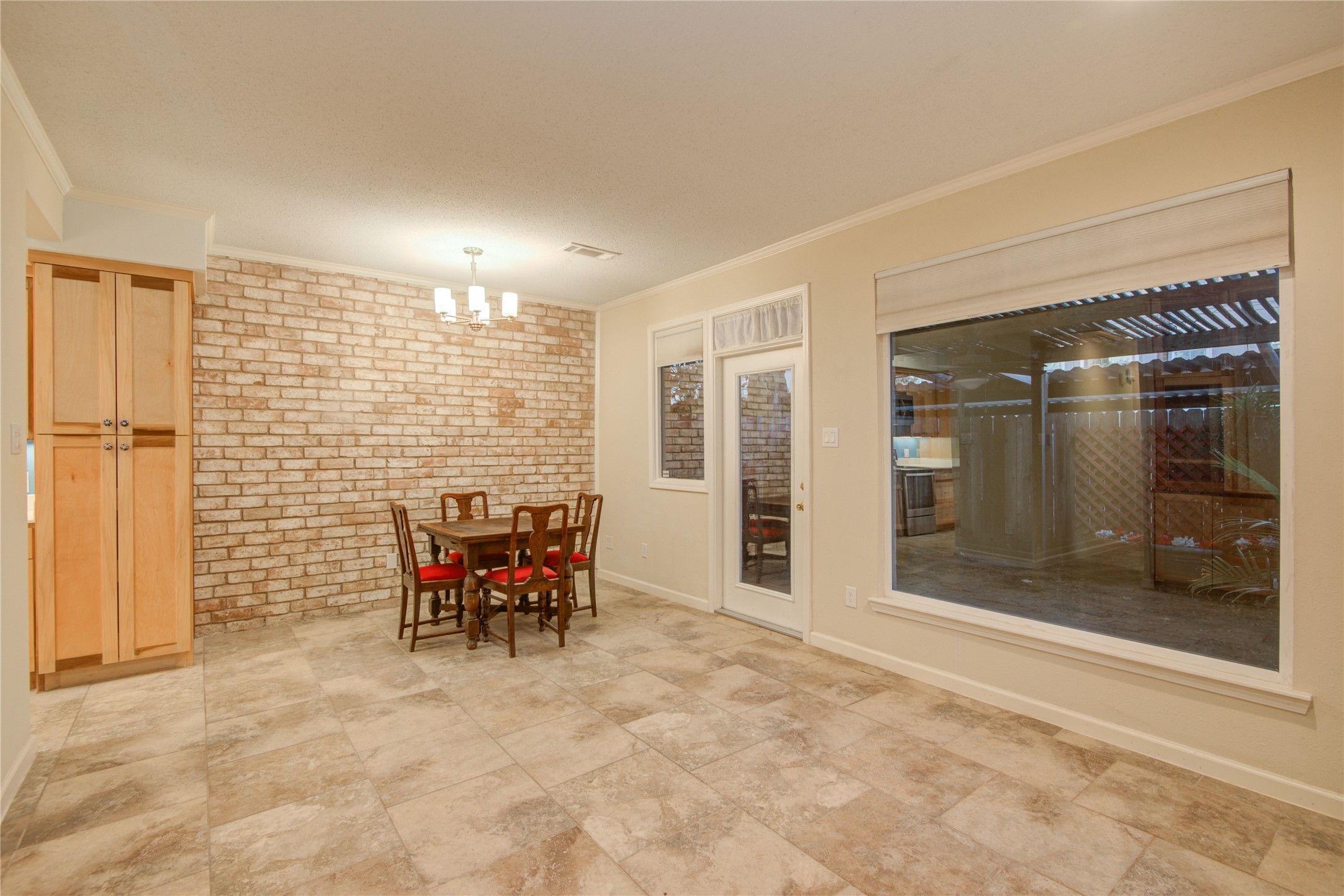 7449 Brompton Street, Unit 7449 Houston, TX 77025 - Photo 19 of 46 Family room has amazing new windows into the private patio
