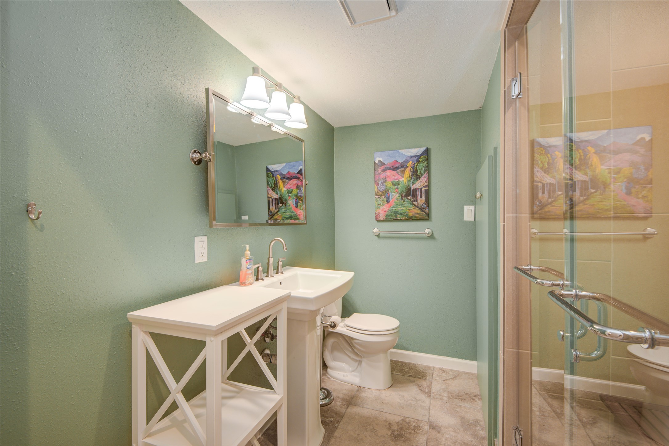 7449 Brompton Street, Unit 7449 Houston, TX 77025 - Photo 20 of 46 a bathroom with a sink mirror and a toilet