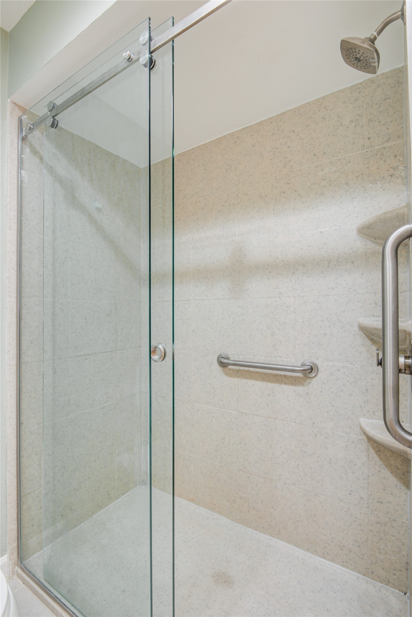 7449 Brompton Street, Unit 7449 Houston, TX 77025 - Photo 33 of 46 a bathroom with a glass shower door