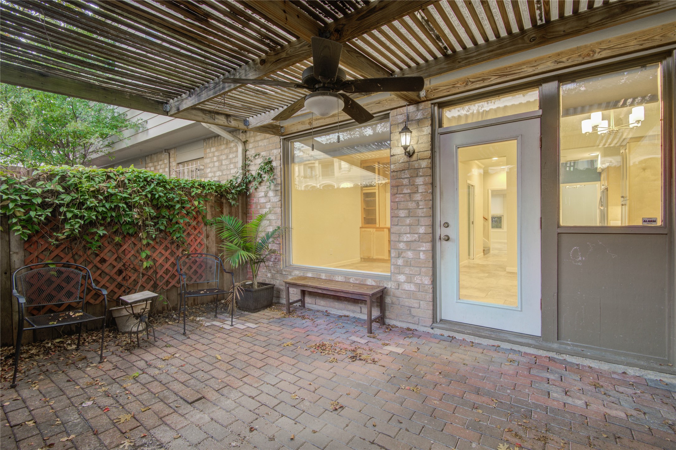 7449 Brompton Street, Unit 7449 Houston, TX 77025 - Photo 36 of 46 Ceiling fan & cover makes the private patio perfect for year round enjoyment