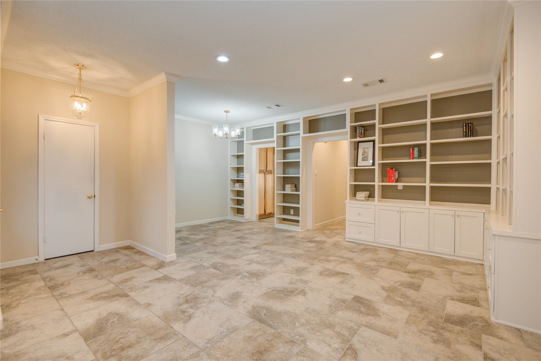 7449 Brompton Street, Unit 7449 Houston, TX 77025 - Photo 7 of 46 Custom built book cases & cabinetry in the living/dinning rooms