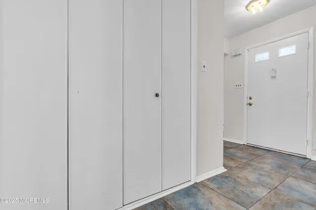a view of a hallway with closet area
