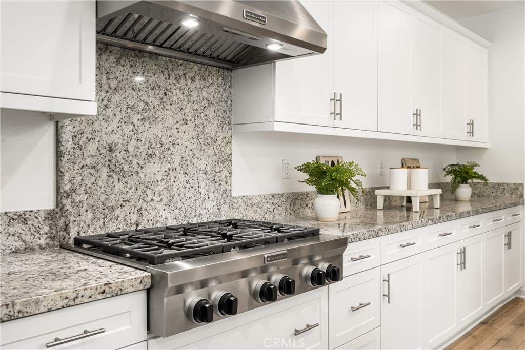 186 Terrapin Irvine, CA 92618 - Photo 11 of 39 a white stove top oven sitting inside of a kitchen