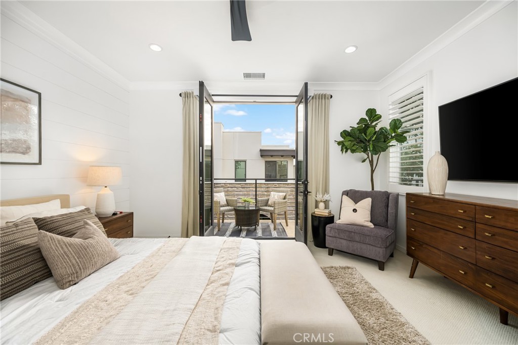 186 Terrapin Irvine, CA 92618 - Photo 13 of 39 a bedroom with a bed and a flat screen tv