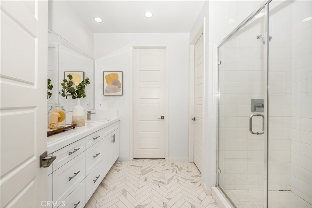 186 Terrapin Irvine, CA 92618 - Photo 15 of 39 a bathroom with a shower sink and mirror
