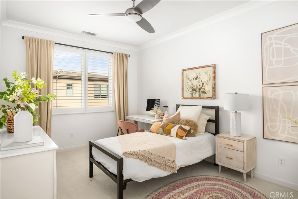 186 Terrapin Irvine, CA 92618 - Photo 18 of 39 a bedroom with a bed and a table