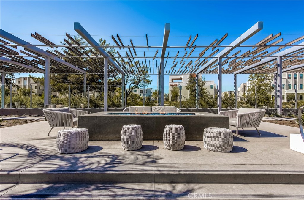 186 Terrapin Irvine, CA 92618 - Photo 30 of 39 a view of a patio with a table and chairs