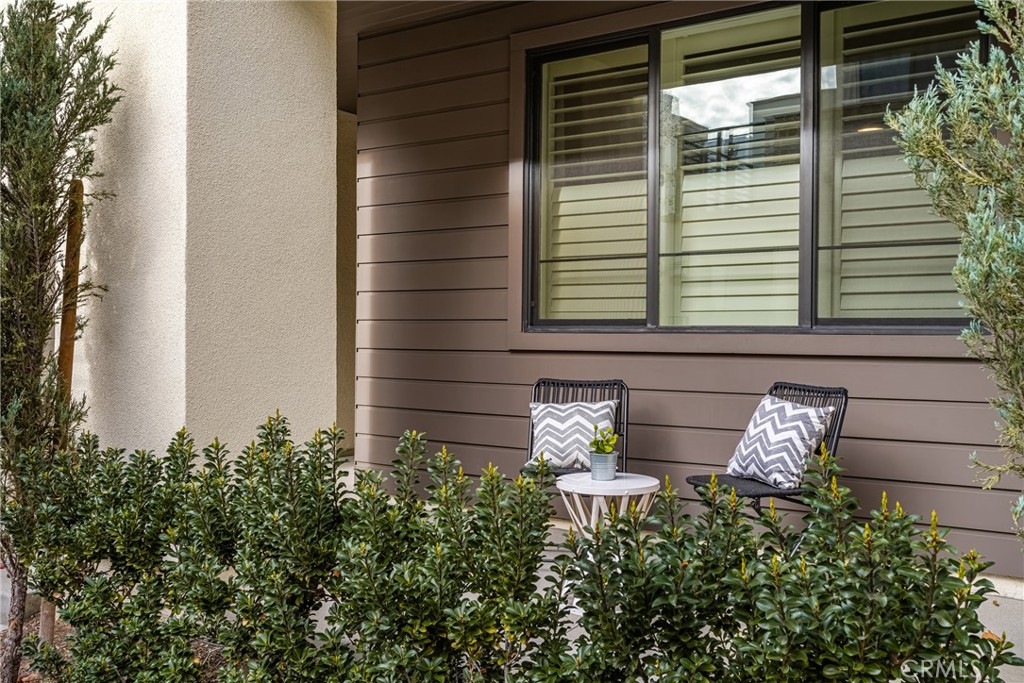 186 Terrapin Irvine, CA 92618 - Photo 4 of 39 a view of a balcony with chair and potted plants