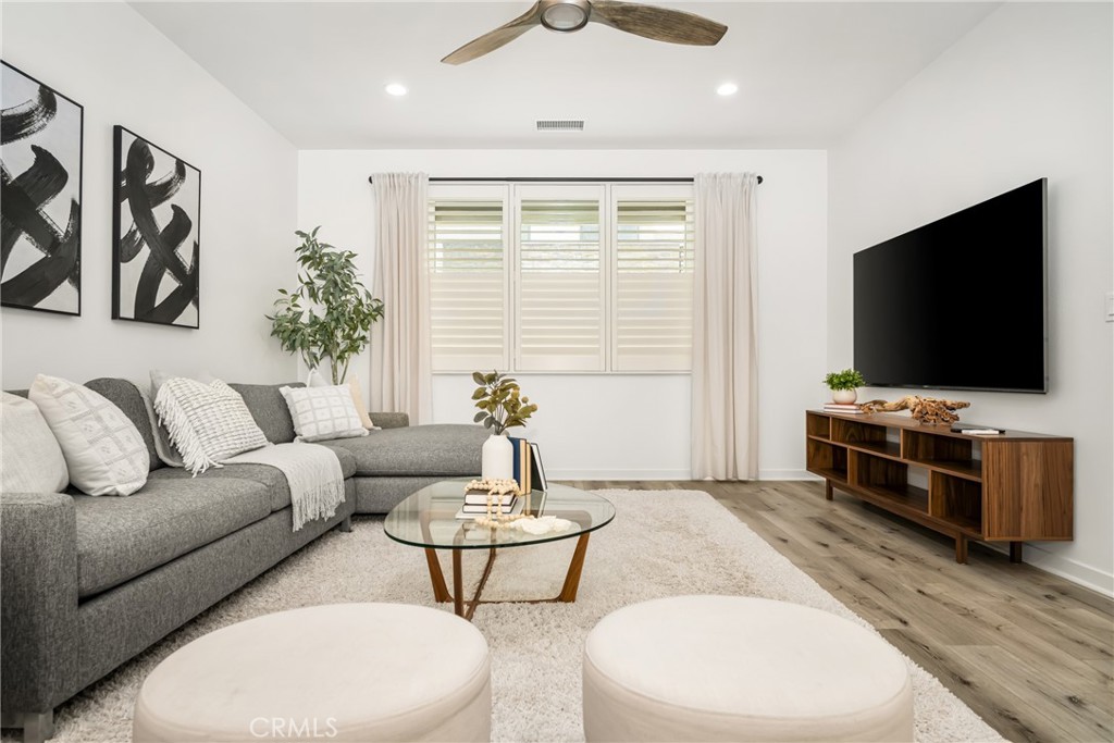 186 Terrapin Irvine, CA 92618 - Photo 5 of 39 a living room with furniture and a flat screen tv